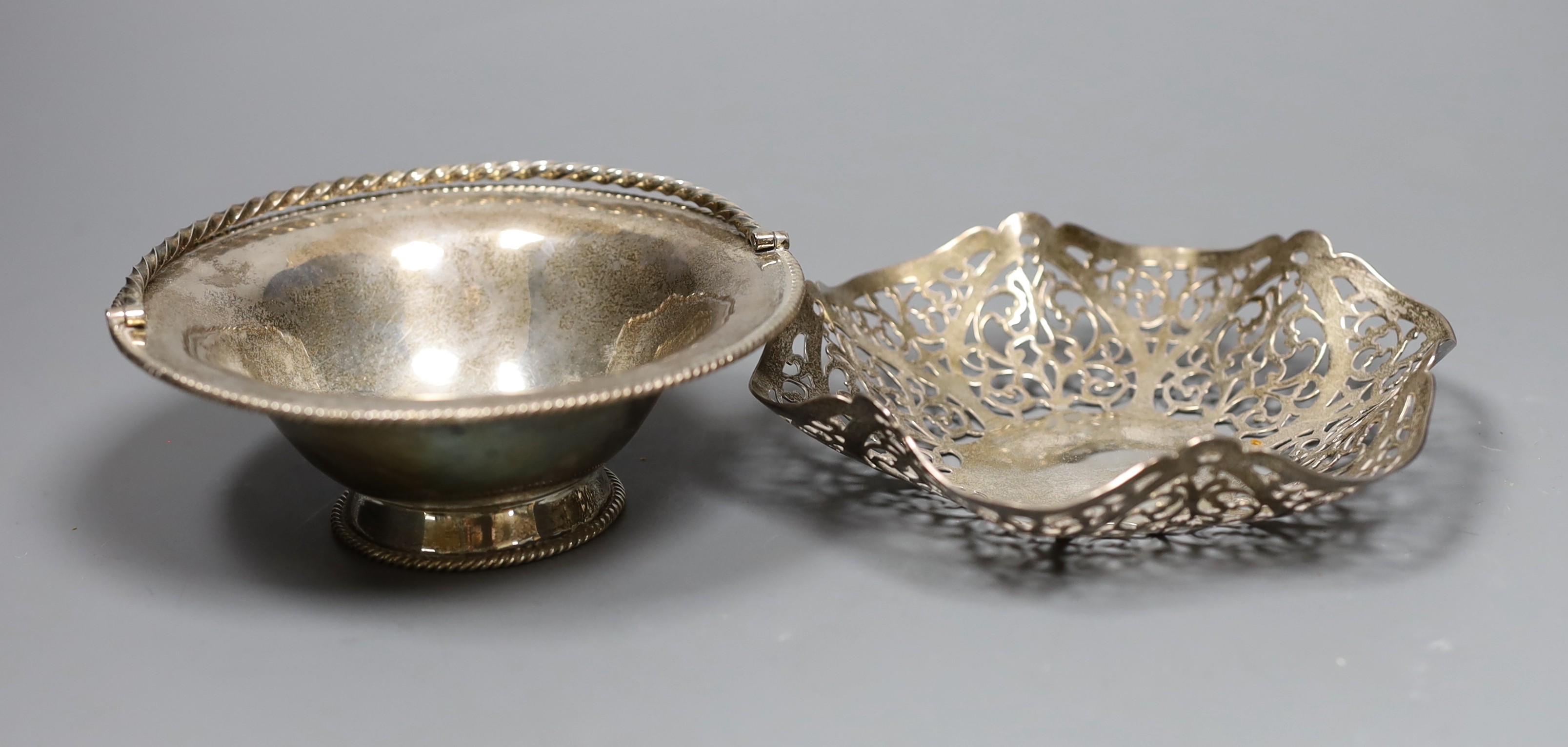 A silver bon bon dish by DRC, London, 1978, 14.1cm and a small silver bonbon basket by Rodney Clive Pettit, London, 1983, 8.3oz.